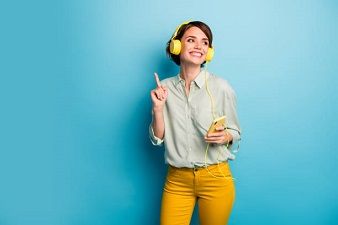 Photo of funny cheerful lady listening music - Impact of Music on Human Life